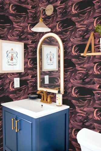 Fancy Walls removable wallpaper showcasing swirling maroon brushstrokes for a modern abstract look.