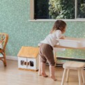 Fancy Walls peel and stick wallpaper with mint green star pattern creating a soft and playful boho interior mood.