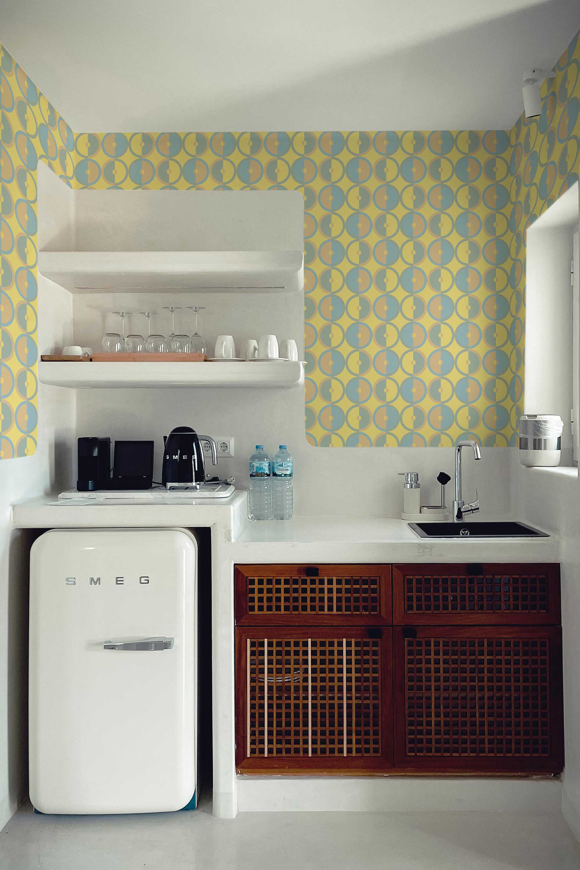 Fancy Walls vibrant midcentury geometric pattern self-adhesive wallpaper in warm mustard yellow tones.