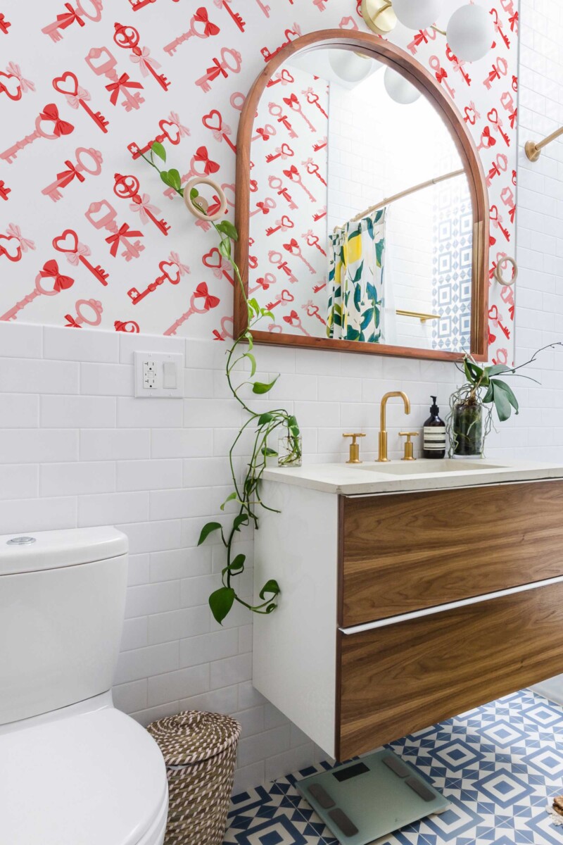 Fancy Walls peel and stick wallpaper with pink keys and hearts creating a cute Valentine inspired kawaii pattern.