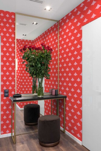 Fancy Walls self-adhesive wallpaper featuring pink heart illusion patterns with a fun romantic style.