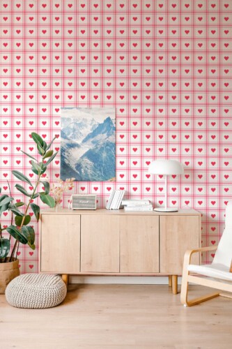 Fancy Walls self-adhesive wallpaper featuring pink and red hearts arranged in a neat plaid pattern.