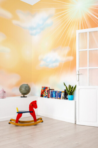 Fancy Walls sunny sky glow wall mural with pastel clouds and radiant sun rays