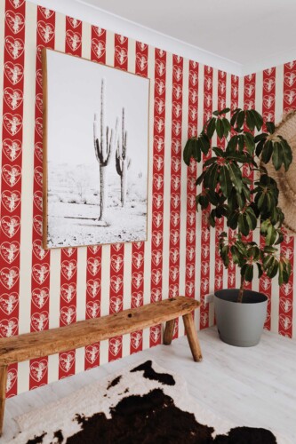 Fancy Walls traditional wallpaper inspired by vintage cupid imagery and classic romantic patterns.