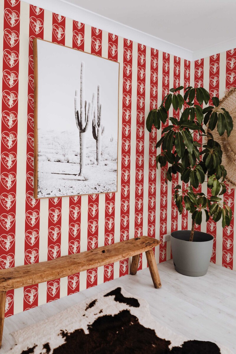 Fancy Walls traditional wallpaper inspired by vintage cupid imagery and classic romantic patterns.