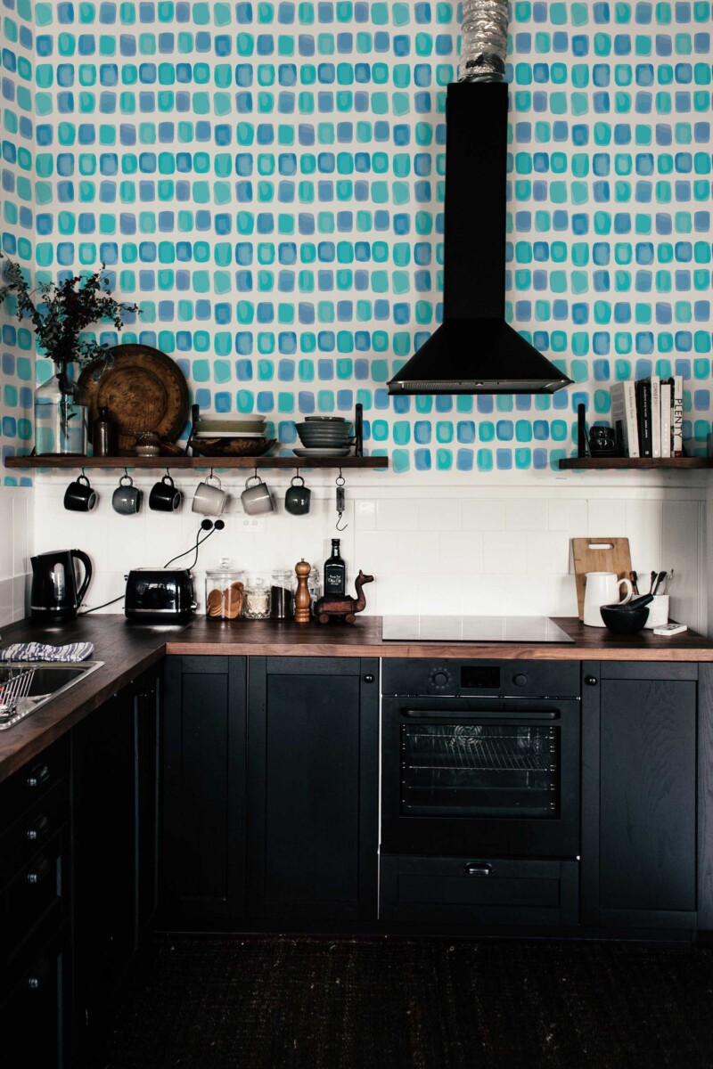 Fancy Walls peel and stick wallpaper with abstract watercolor squares in blue and teal for a calm modern interior.