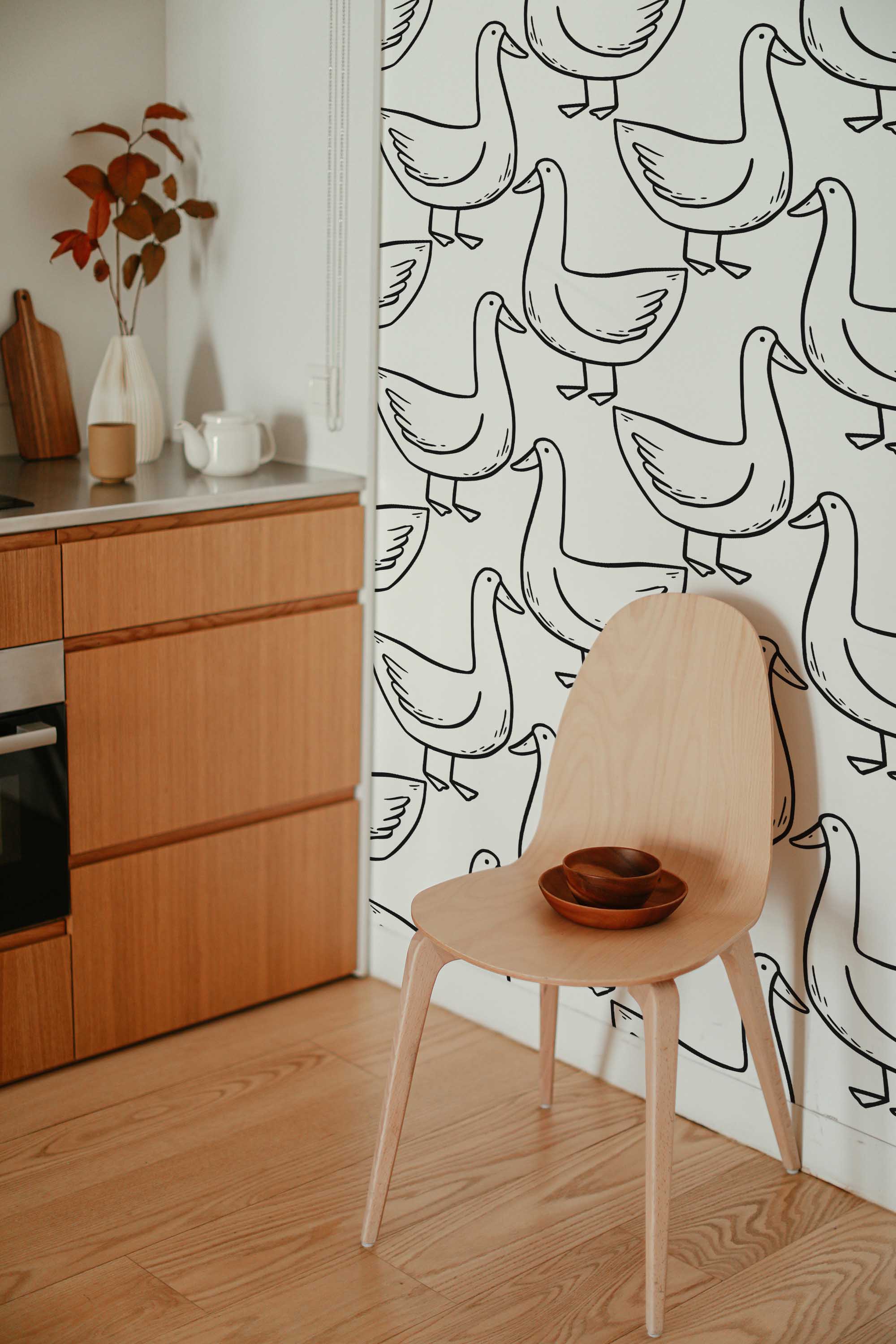 Fancy Walls self-adhesive wallpaper featuring funny black and white goose doodles on white background