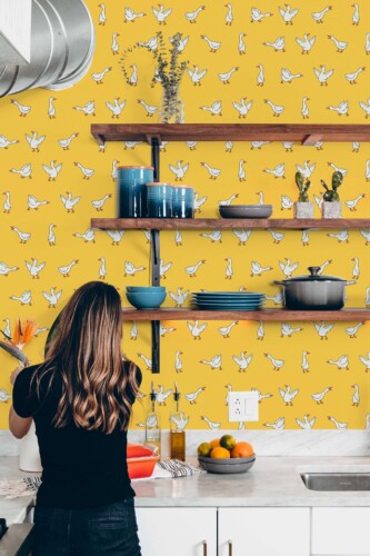 Fancy Walls removable wallpaper with happy flying geese on sunny yellow backdrop