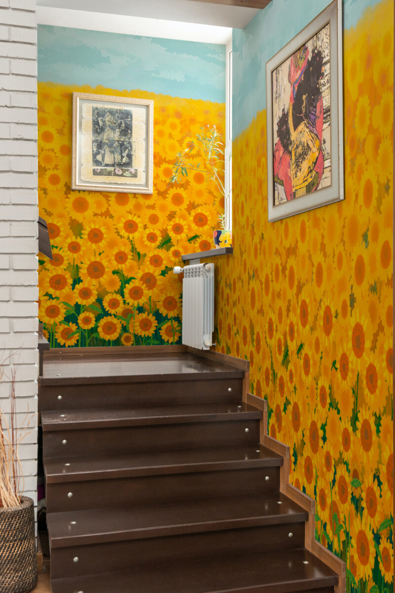 Fancy Walls removable wall mural with golden sunflower field design for modern floral interiors and sunny statement living spaces.