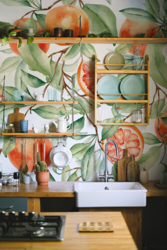 Fancy Walls peel and stick PVC-free wall mural with watercolor grapefruit branches and orange fruits for tropical kitchen and beach-inspired interiors.