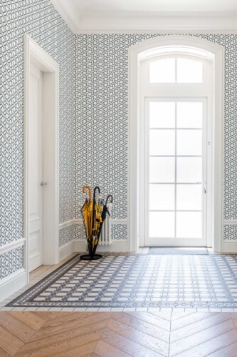 Fancy Walls peel and stick wallpaper with gray geometric lattice on crisp white background.