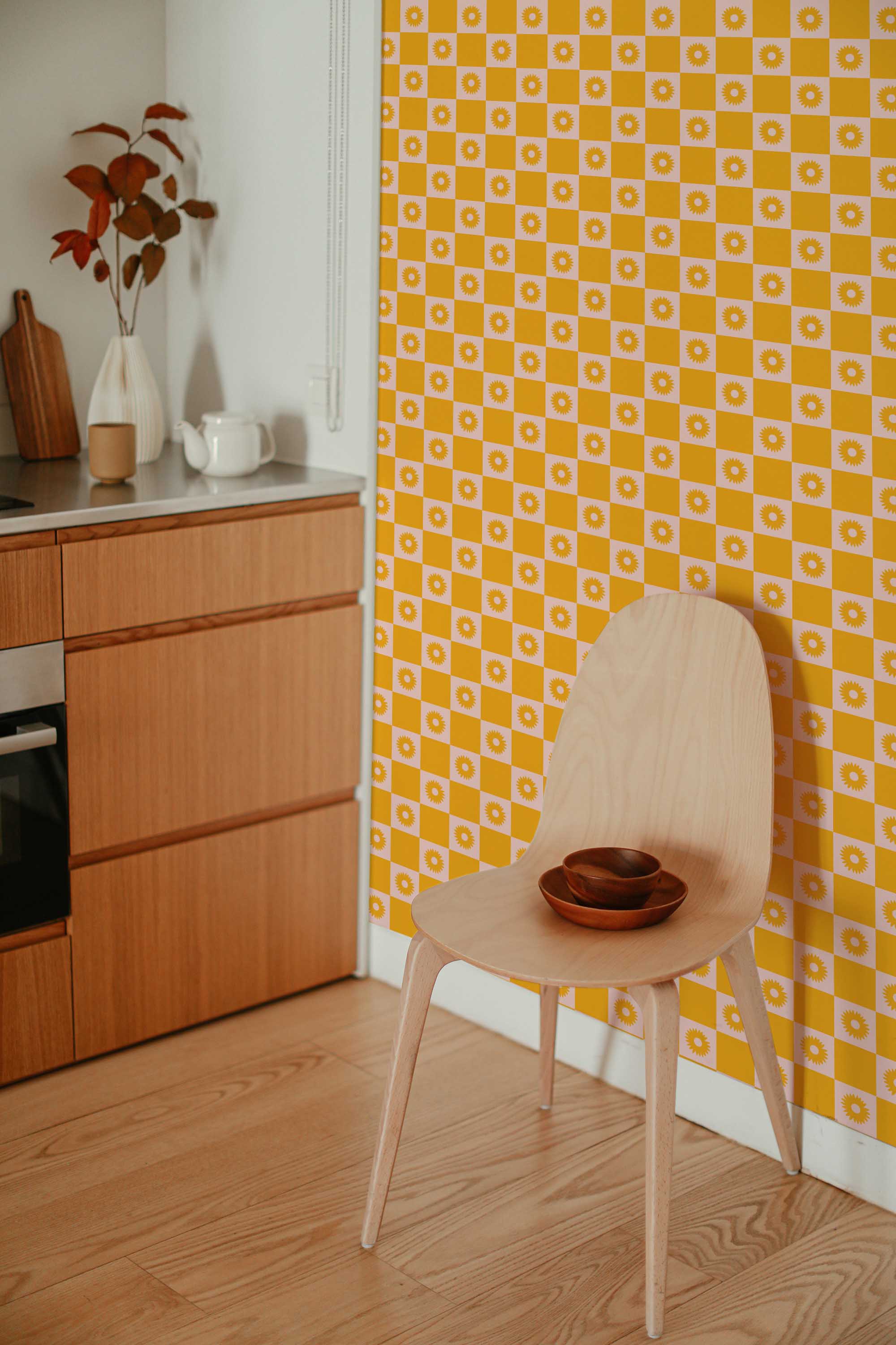 Fancy Walls self-adhesive wallpaper featuring cute mustard yellow checkered sunflowers with pink accents