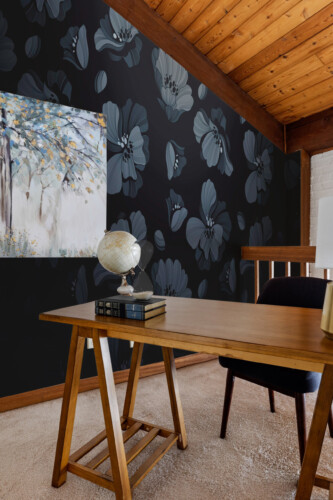 Fancy Walls peel and stick PVC-free wall mural with light blue retro daisies on dark gradient background for stylish living room décor and vintage interiors.