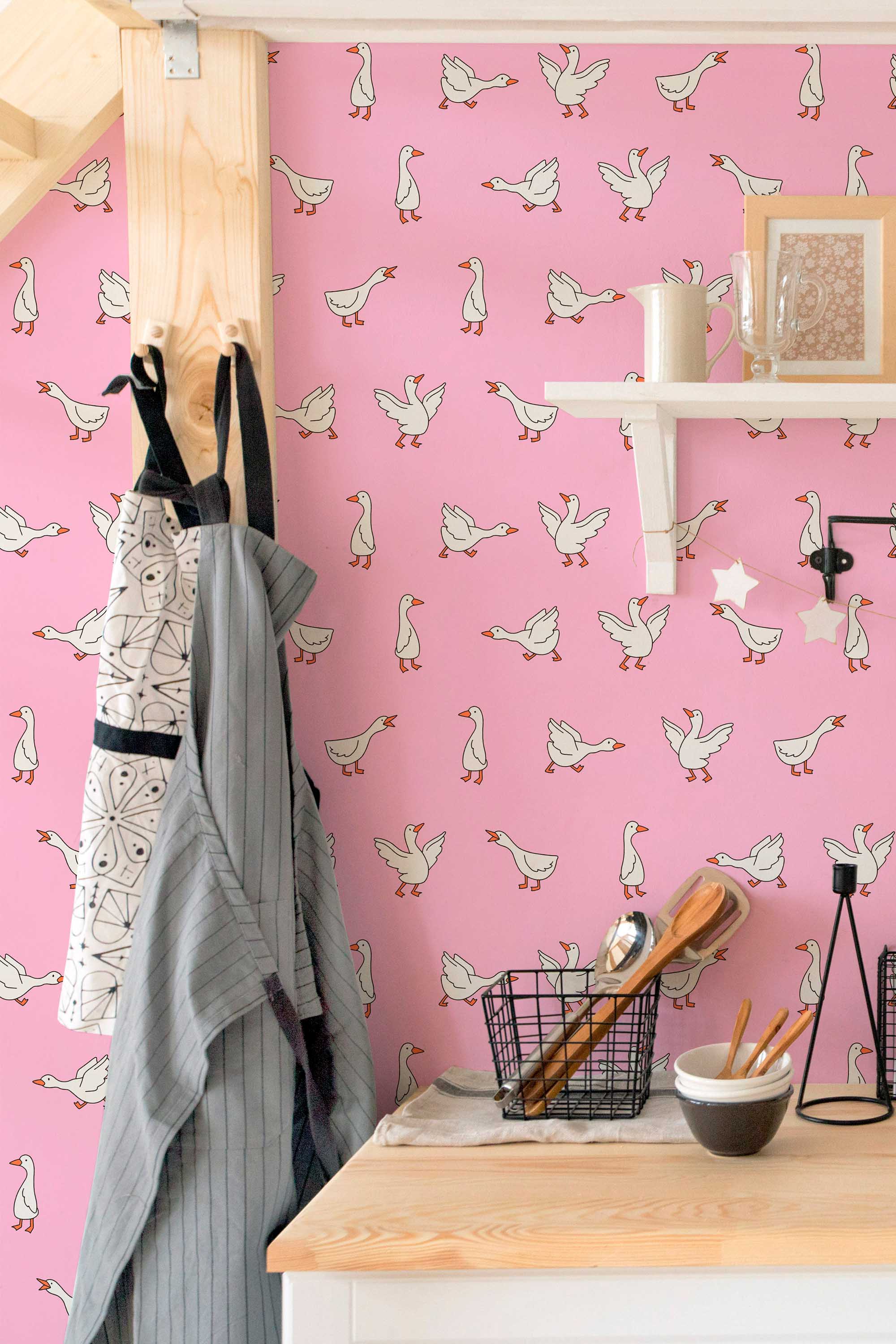 Fancy Walls self-adhesive wallpaper featuring uplifting pink geese in motion pattern