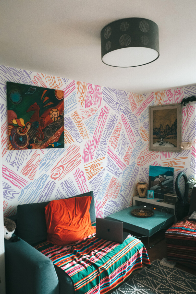 Fancy Walls peel and stick wall mural with colorful wood plank line art pattern on white background for modern office and home office spaces. PVC-free wallpaper mural.