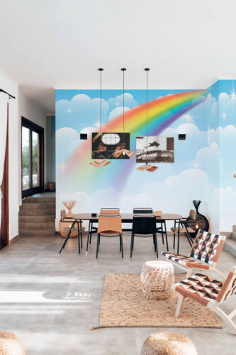 Fancy Walls commercial peel and stick wall mural with pastel rainbow clouds for bright kindergarten interiors and modern kids playroom décor.
