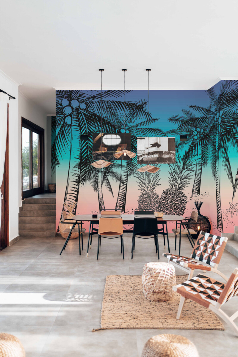 Fancy Walls removable wall mural with tropical sunset gradient and sketch palms for vibrant living room spaces and contemporary coastal homes.