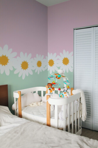Fancy Walls removable wall mural with gentle floral horizon design for nursery walls, kids bedrooms, and soft modern interiors.
