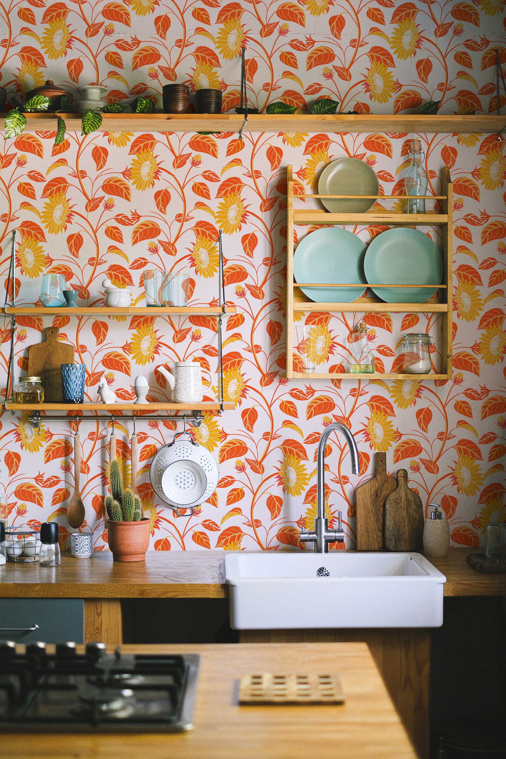 Self-adhesive wallpaper from Fancy Walls featuring retro floral sunflowers in warm red shades for stylish bedrooms