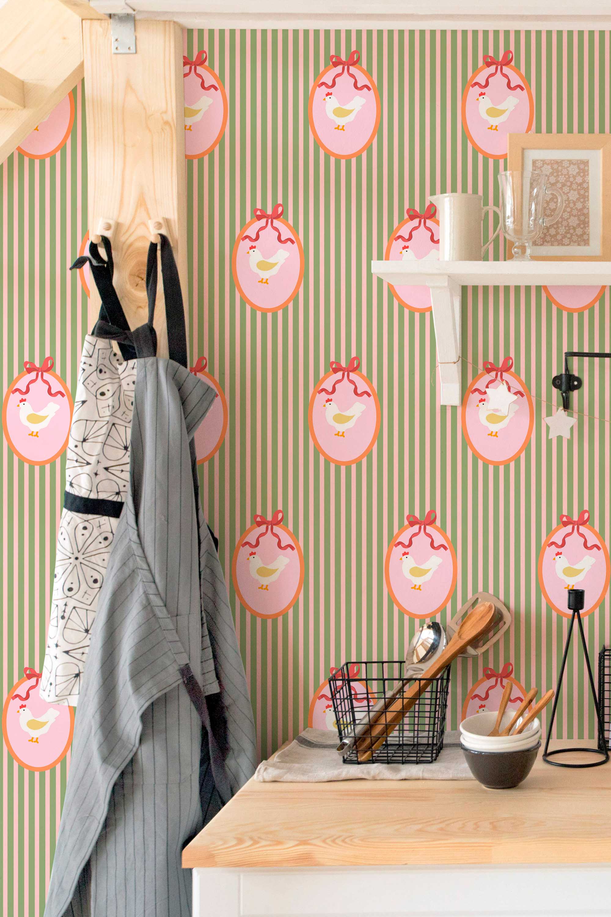 Self-adhesive wallpaper by Fancy Walls featuring cute green hens and soft stripes for relaxed country living spaces