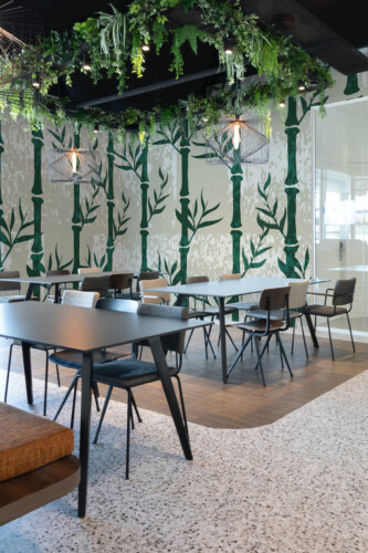 Fancy Walls Grunge Bamboo peel and stick PVC-free wall mural with dark green bamboo stems over faux textured neutral background for calm nature-inspired décor.