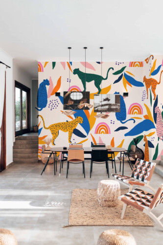 Fancy Walls peel and stick PVC-free wall mural with colorful cheetah pattern and abstract leaves for kids rooms, nurseries, and modern playful interiors.