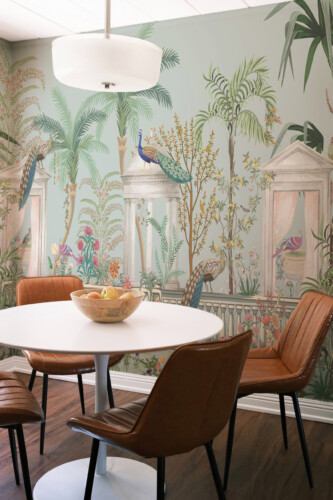 Fancy Walls peel and stick PVC-free wall mural with elegant peacocks, classical columns, and lush tropical garden details for living rooms and refined interiors.