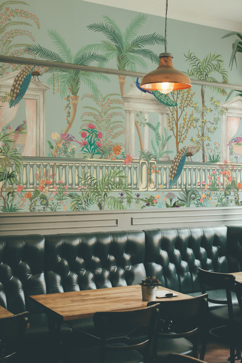 Fancy Walls traditional non-pasted eco-friendly wall mural featuring vintage peacock terrace scene with palms and florals for bedrooms and dining spaces.