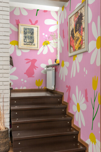 Fancy Walls Spring Bunny Meadow eco-friendly peel and stick wall mural with cute bunny shapes and spring flowers for nursery décor.