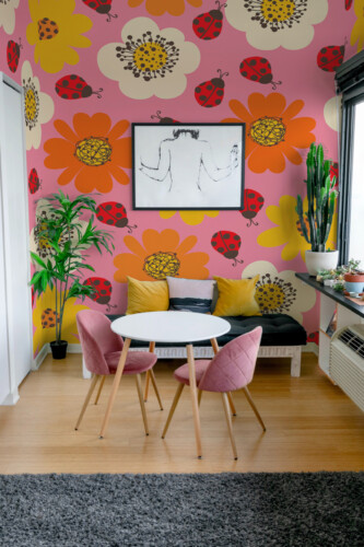 Fancy Walls Sunny Ladybug Flowers peel and stick PVC-free wall mural with red ladybugs and retro floral pattern for cheerful kids room décor.