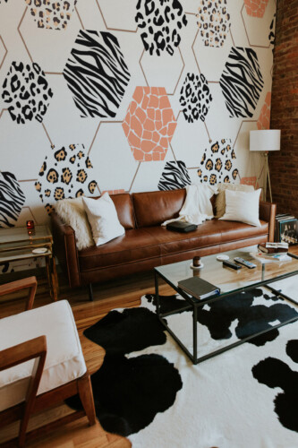 Wild Safari Hexagon peel and stick wall mural with geometric animal prints including zebra, leopard, and giraffe patterns, creating modern décor for living room