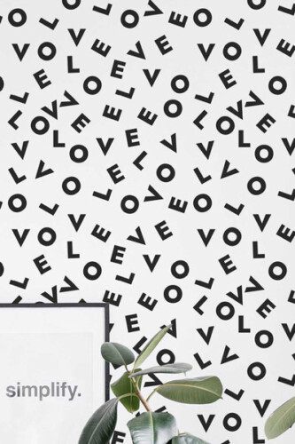 Wallpaper with the words "love" from the Fancy Walls words and letters peel and stick wallpaper collection