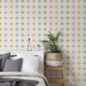 Colorful Retro Polka Dot non-pasted wallpaper covering a bedroom accent wall with large white circles over pastel shapes.