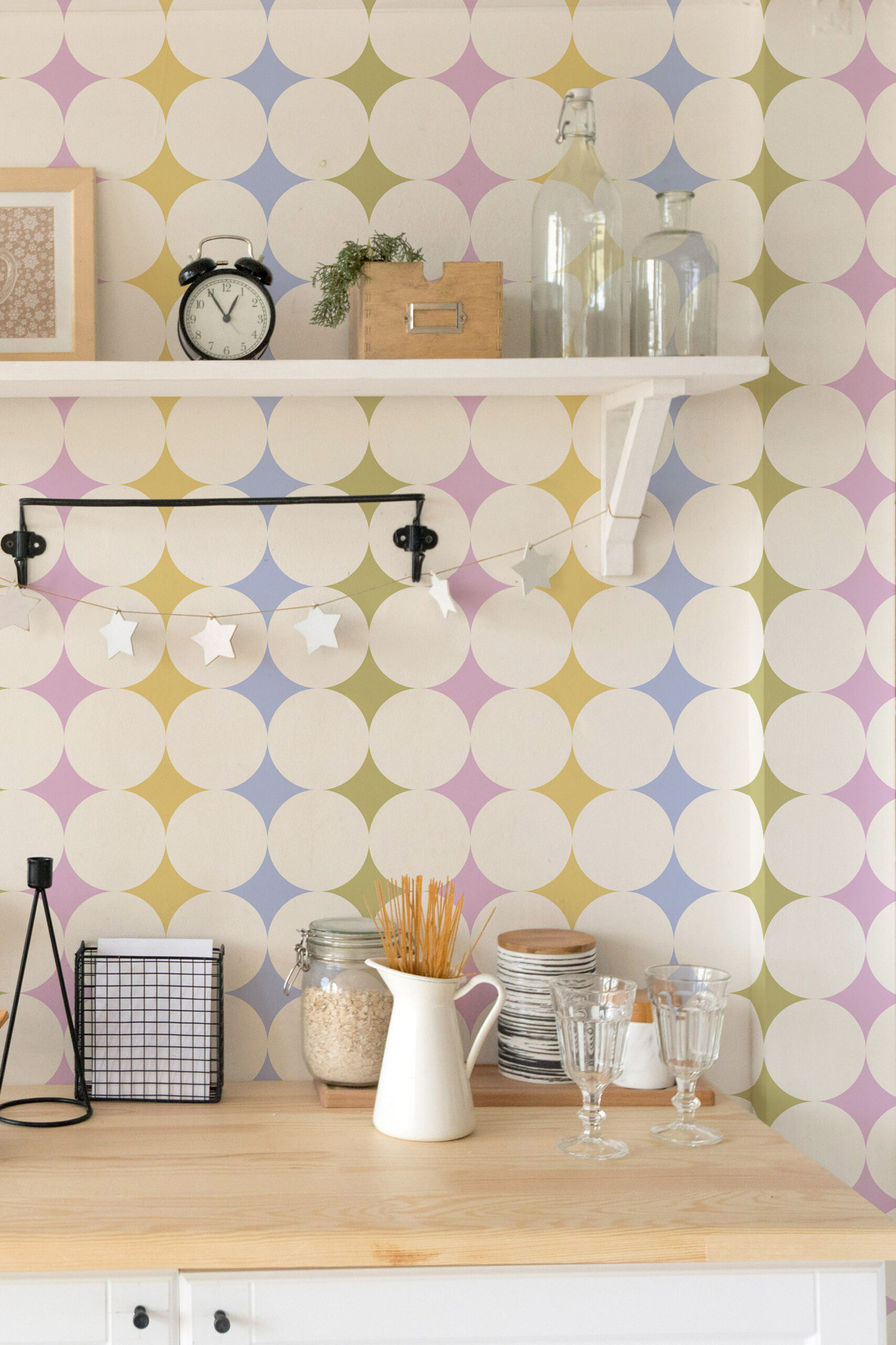Colorful Retro Polka Dot pre-pasted wallpaper with large beige circles and pastel diamond shapes behind open shelves.