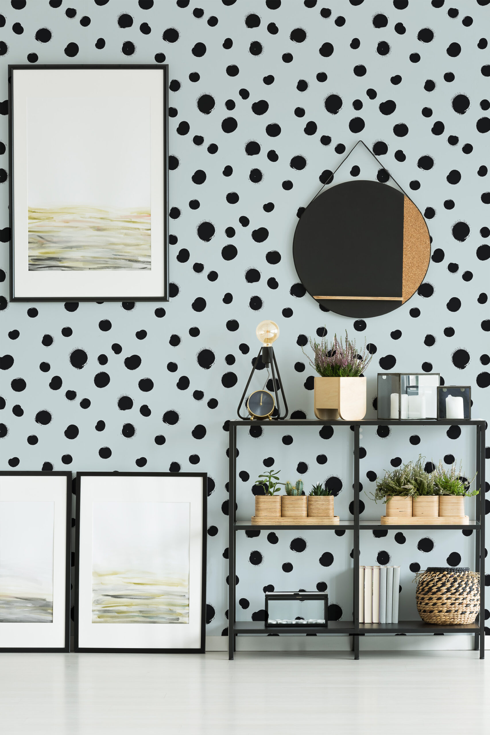 Distressed Blue Polka Dot self-adhesive wallpaper covers the wall, with scattered black dots behind a shelving unit.