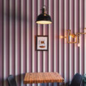 Bold Pink Stripe peel and stick wallpaper with vertical pink, mauve, and white stripes covering the dining wall.