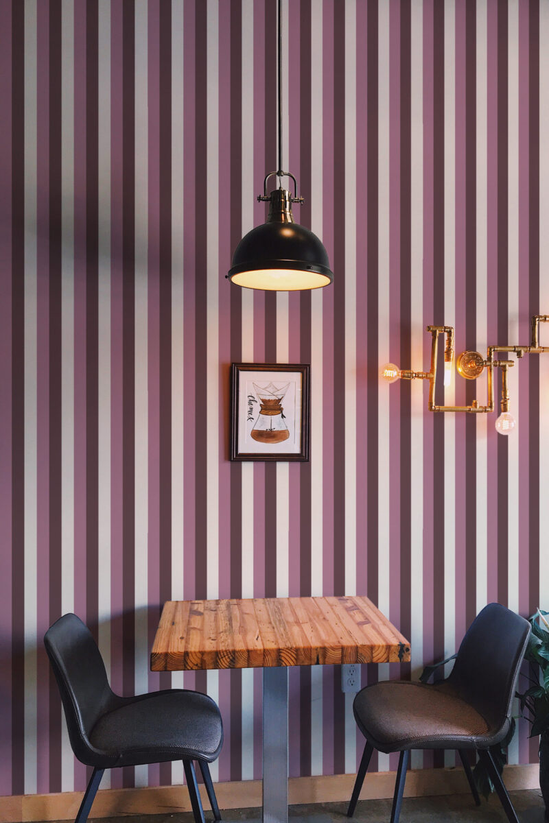 Bold Pink Stripe peel and stick wallpaper with vertical pink, mauve, and white stripes covering the dining wall.