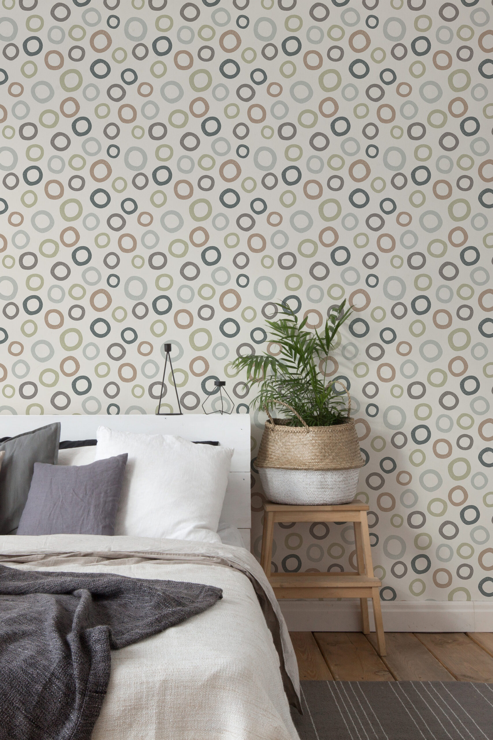 Scattered Beige Ring Dots non-pasted wallpaper adds multicolor ring dots across a bedroom accent wall behind the bed.