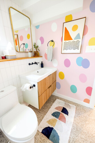 Candy Pastel Polka Dots peel and stick wall mural with colorful soft dots on blush pink background, perfect for nursery décor