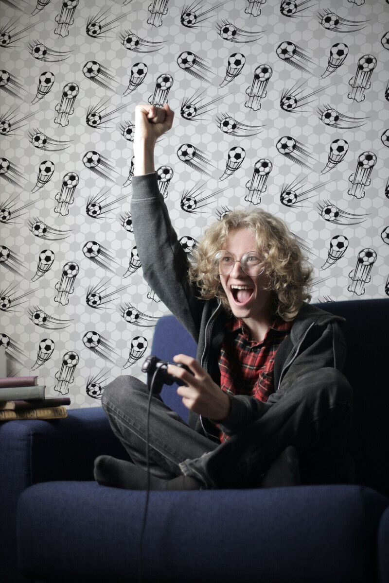 Dynamic Soccer peel and stick wallpaper with footballs in motion over hexagon background, perfect for game room décor