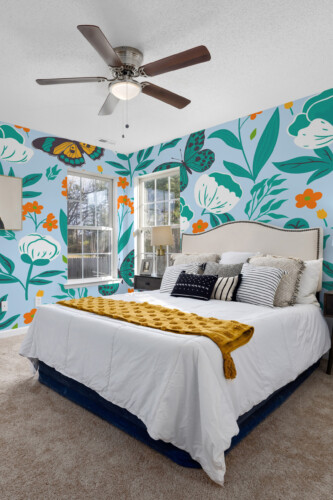 Floral Butterfly Bliss peel and stick wall mural with butterflies and wildflowers on light blue background, perfect for bedroom décor