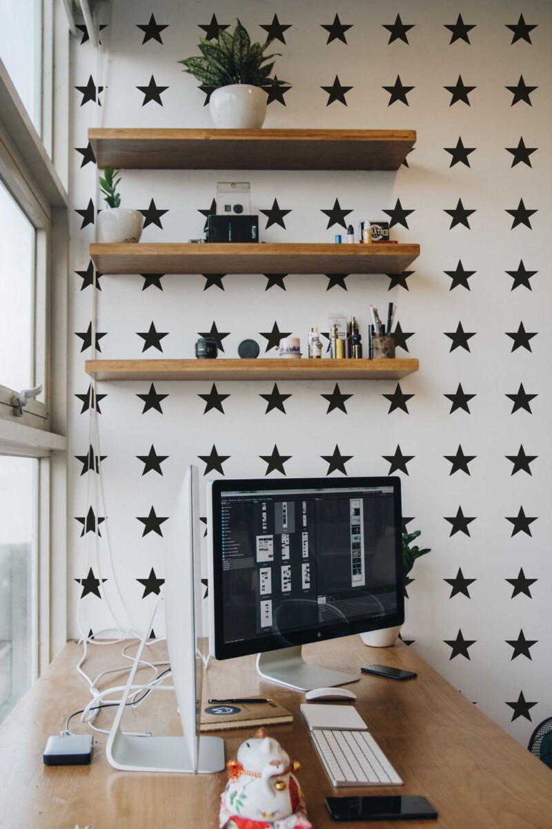 Removable wallpaper by Fancy Walls with evenly spaced black stars on crisp white background