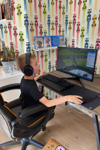 Speed Racing Cars peel and stick wallpaper with colorful formula cars and speed trails, perfect for game room décor