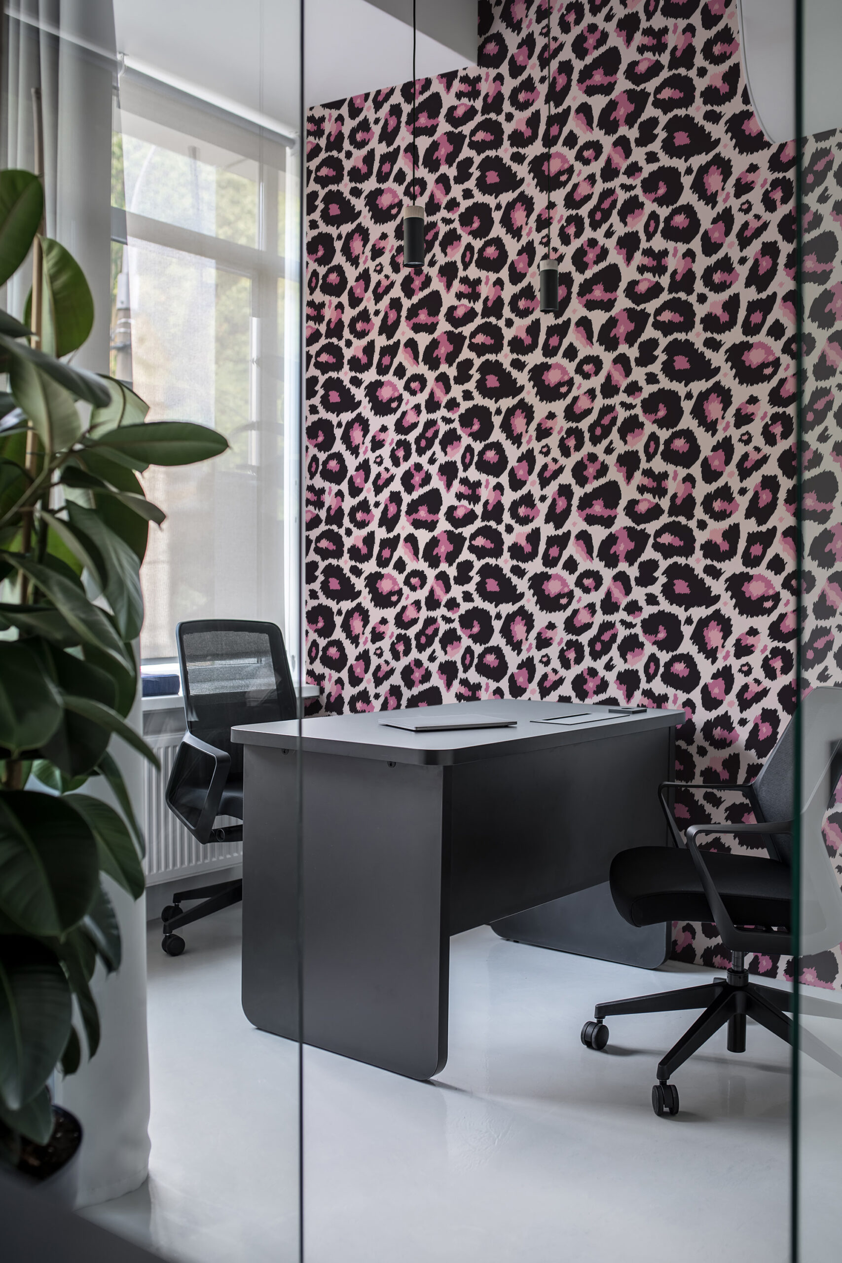 Bold Pink Leopard pre-pasted wallpaper with black and pink leopard spots covering the office wall behind a desk.