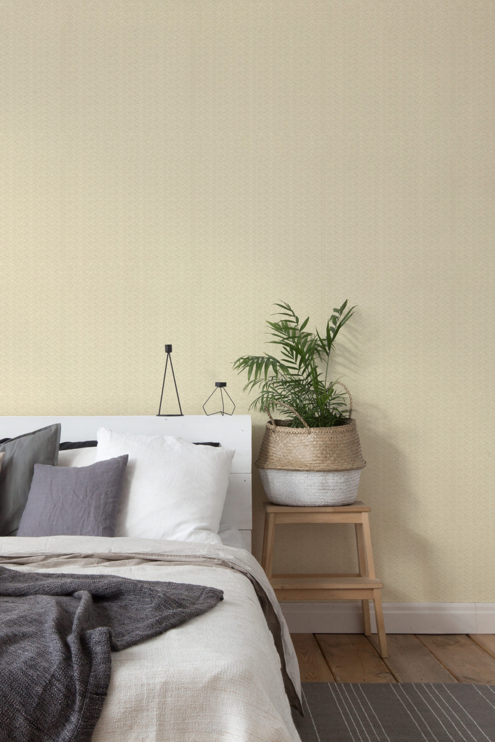 Fine Beige Fabric Look pre-pasted wallpaper with a subtle woven texture behind a bed and a wooden side table.