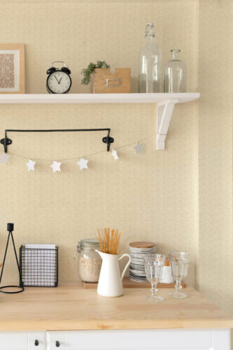 Fine Beige Fabric Look peel and stick wallpaper with a subtle woven texture behind a kitchen counter and open shelf.