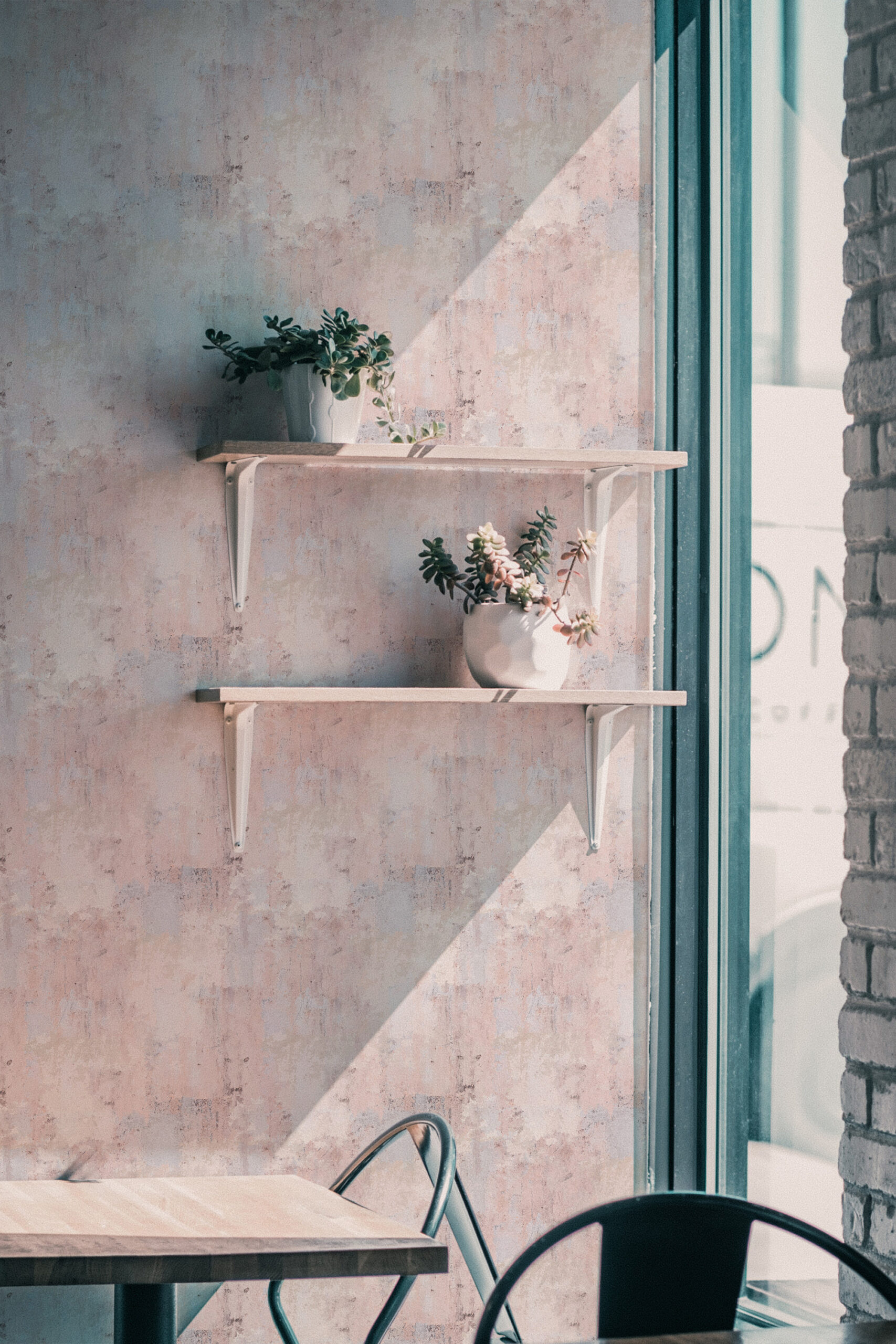 Soft Blush Wash self-adhesive wallpaper with a subtle pink and beige wash texture behind floating shelves.