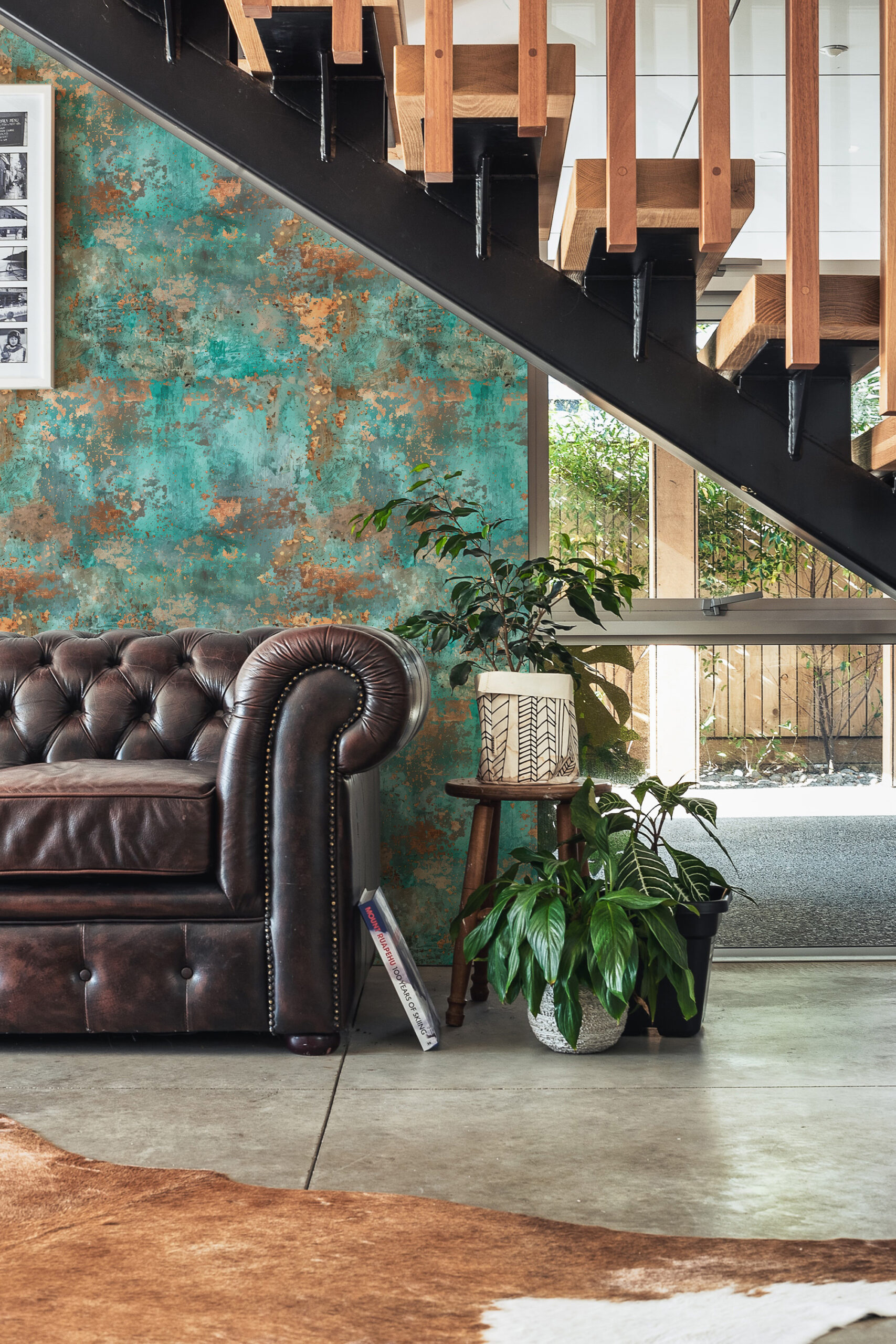 Turquoise Faux Texture pre-pasted wallpaper on an accent wall beneath a modern staircase with rust-like speckling