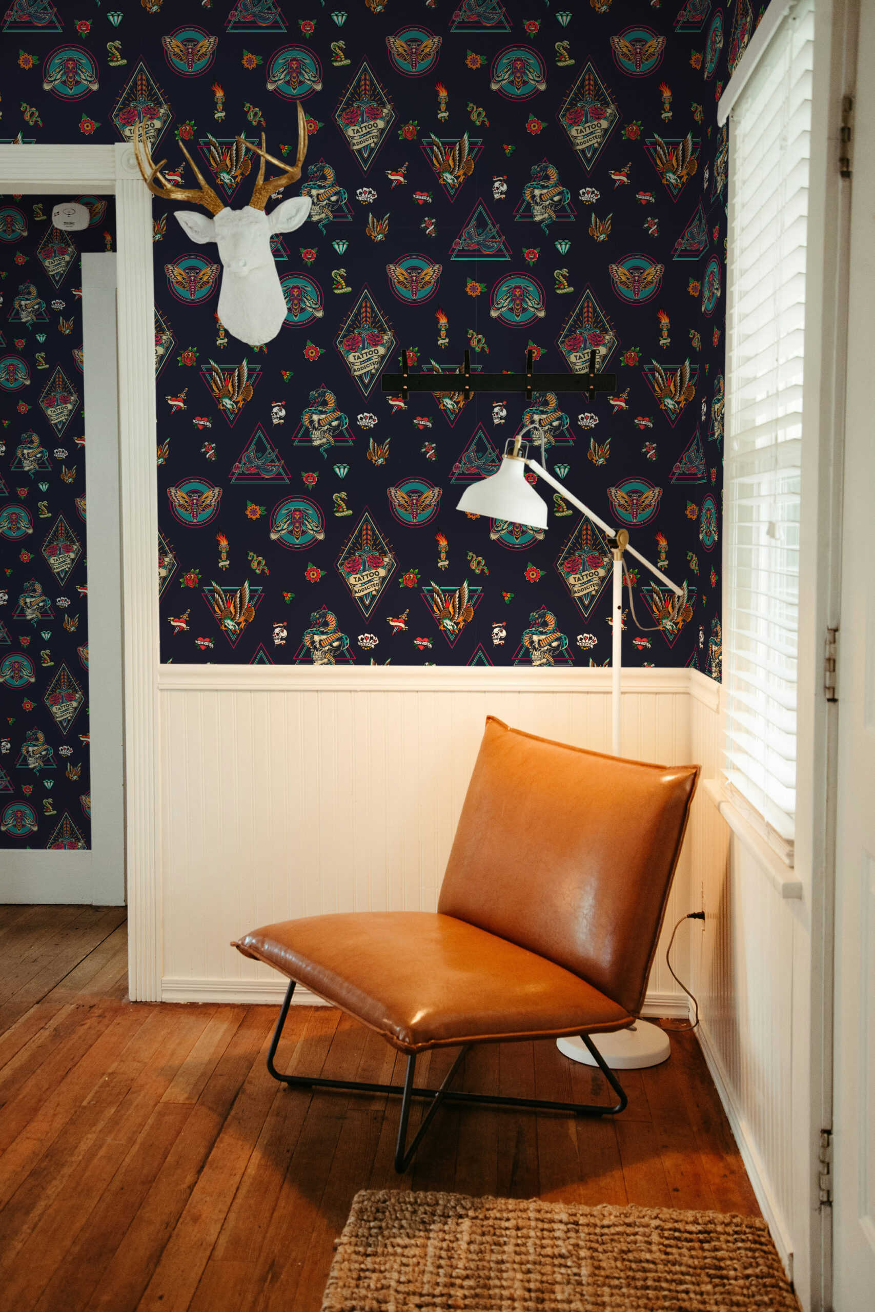 House of Tattoo Icons pre-pasted wallpaper with colorful tattoo-style symbols, wrapping a corner wall beside a window.