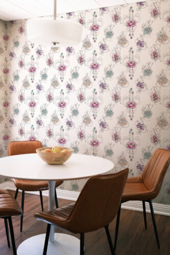 Modern Floral Geometry non-pasted wallpaper with colorful floral line art covers the dining nook wall behind a round table.